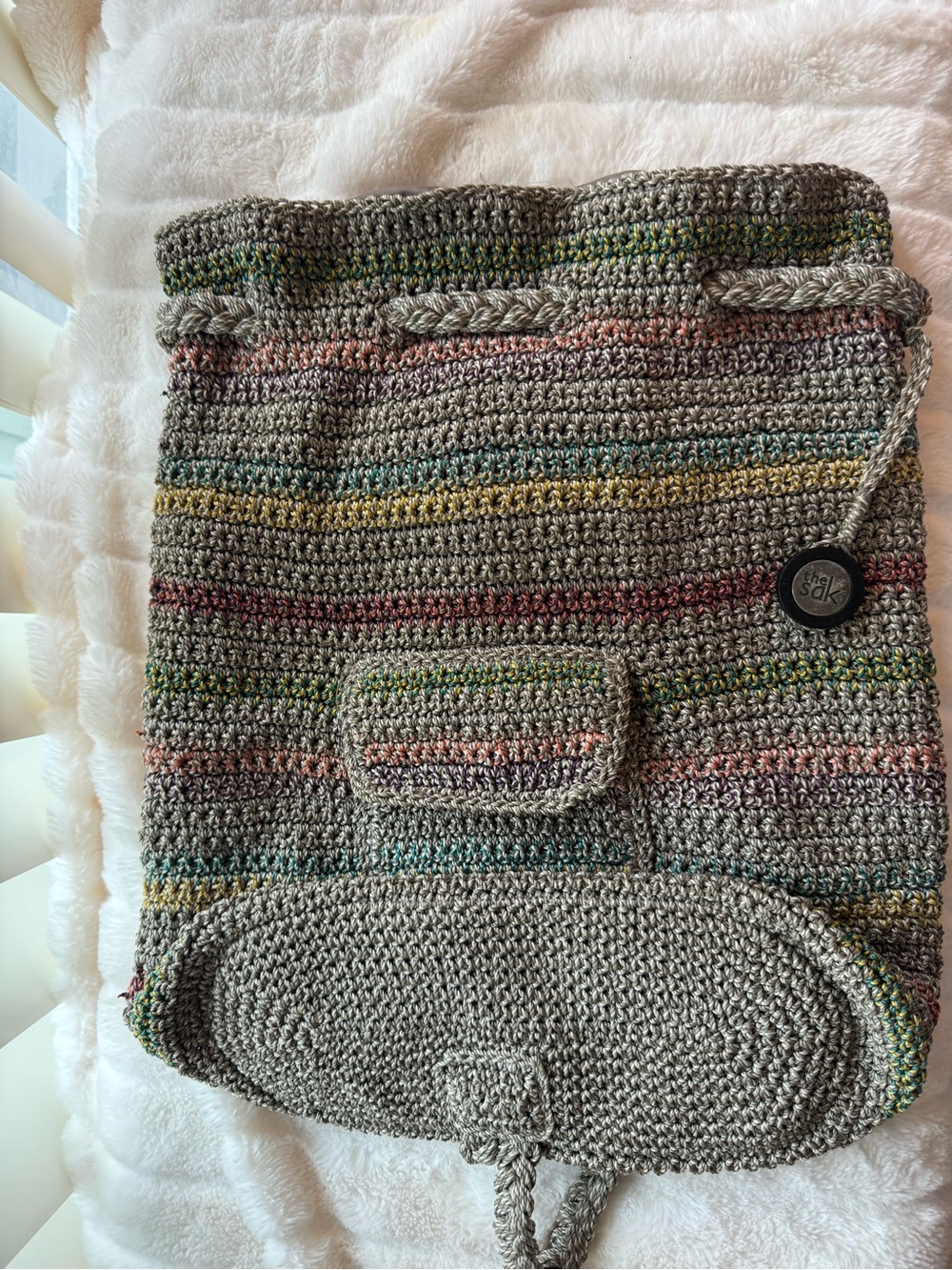 The Sak Beige Crochet Drawstring Tote with Subtle Multicolor Accents